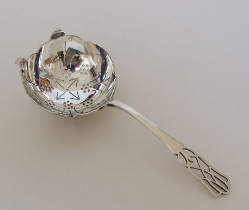 A Gorgeous George V Silver Tea Strainer.