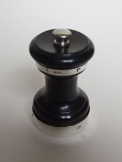 A Victorian Silver and Ebony Pepper Grinder.