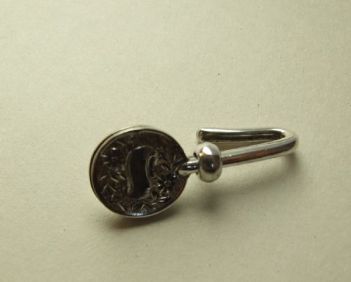 A Charming Victorian Silver Napkin Clip.