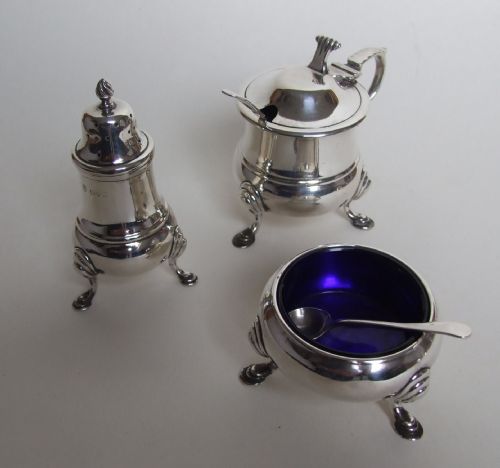 A Handsome Three Piece Silver Cruet with Onlsow Pattern Thumb Grip.