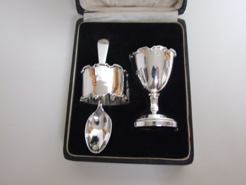 A Lovely George V Boxed Silver Egg Cup, Spoon and Napkin Ring.