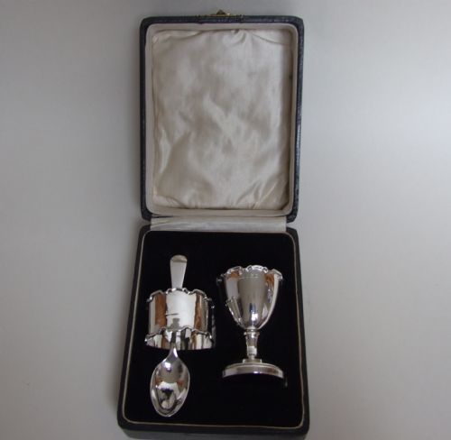 fig 1. A lovely George V boxed silver egg cup, spoon and napkin ring.