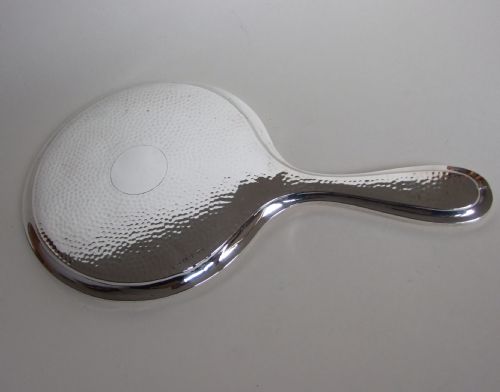 A Stylish Hammered Silver Hand Mirror in the Arts & Crafts Style.