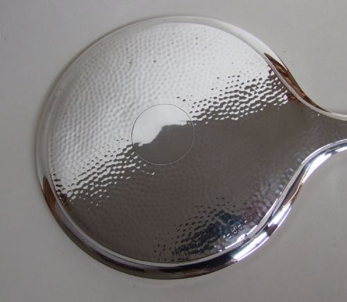 fig 1. A stylish hammered silver hand mirror in the Arts & Crafts style.