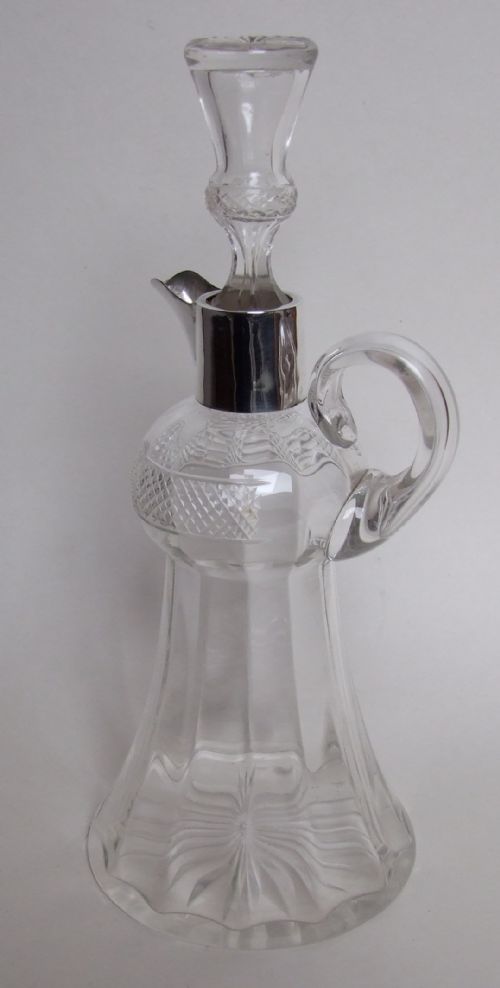 A Superb Edwardian Silver Mounted Whisky Jug.
