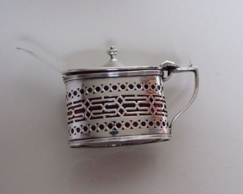 fig 1. A handsome silver mustard pot with unusual cranberry liner.