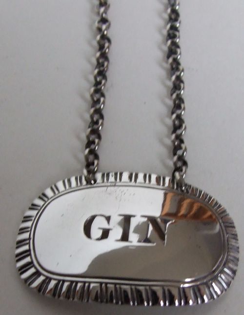 A William IV Silver Gin Decanter Label.