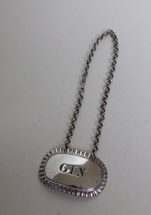 fig 1. A William IV silver Gin decanter label.