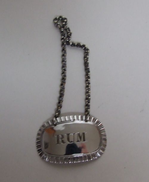 fig 1. An attractive William IV silver 'Rum' label.