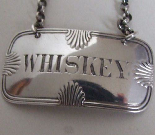 A Rare Early Victorian Silver Whiskey Label.