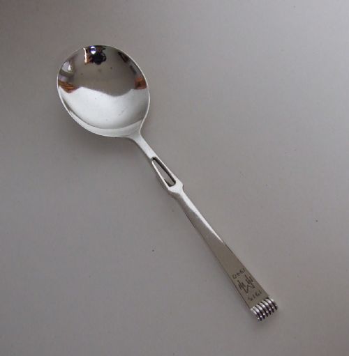 An Unusual Art Deco Silver Honey Spoon.
