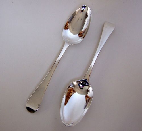 A Rare Pair of George II Silver Serving Spoons.