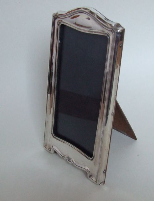 fig 1. A tall rectangular silver photo frame.