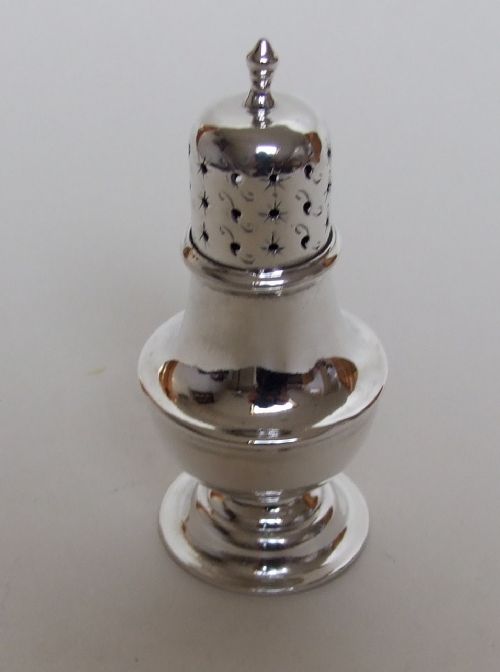 An Attractive Victorian Silver Baluster Pepper Pot.