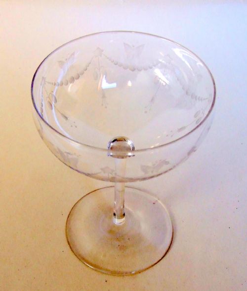 A Butterfly Engraved Victorian Champagne Glass.