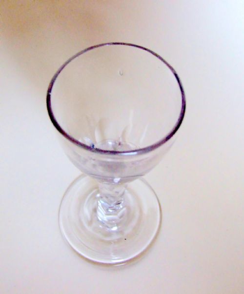 fig 1. An 18th Century cordial glass with facet cut stem.