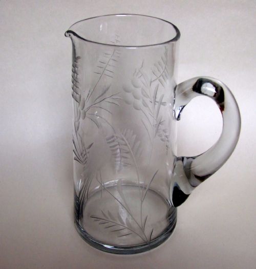 An Appealing Edwardian Engraved Water Jug with Birds and Flowers.
