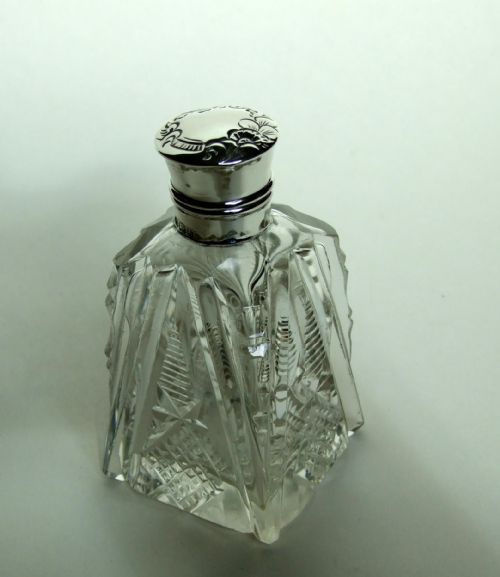 An Edwardian Silver Mounted Cologne Bottle.