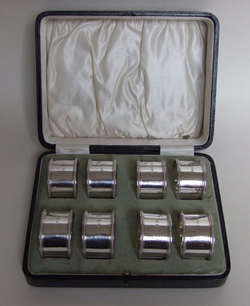 An Extremely Rare Set of 8 Boxed Silver Napkin Rings.