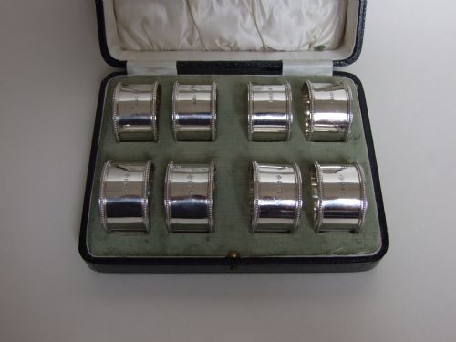 fig 1. An extremely rare set of 8 boxed silver napkin rings.