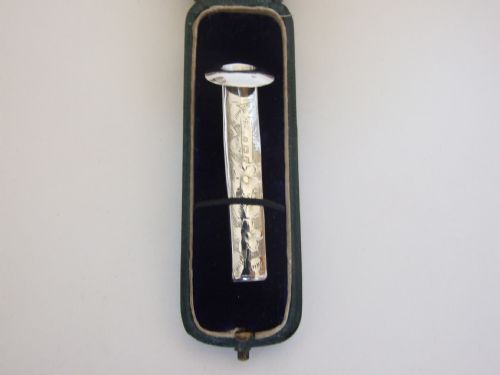 fig 1. An extremely rare Victorian silver button hole holder, in the original box.