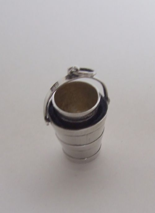 fig 2. A rare mid Victorian silver thimble holder and thimble.