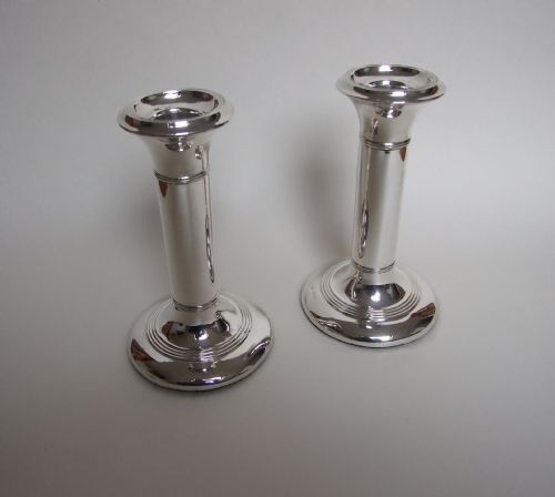 A Stylish Pair of Edwardian Silver Candlesticks.