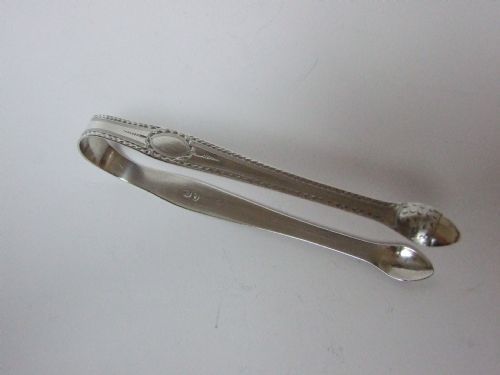 A Pair of Acorn End Hester Bateman Silver Tongs.