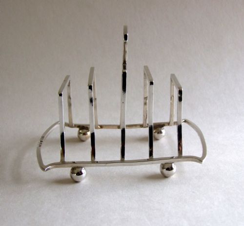 fig 1. An attractive Art Deco silver toastrack.