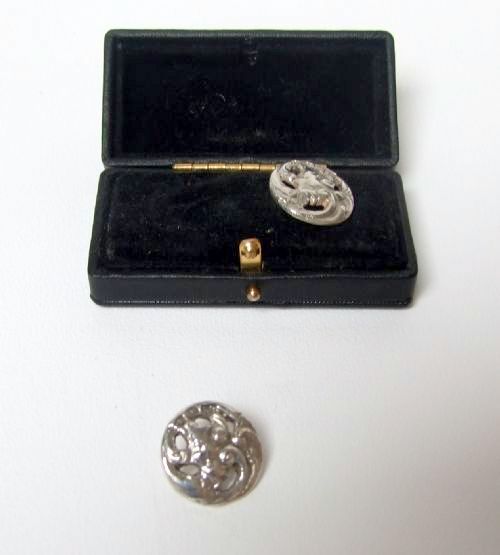 fig 1. A charming pair of cast silver Victorian buttons