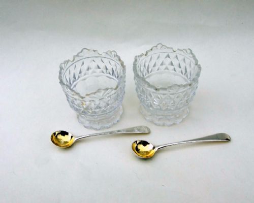 fig 1. A handsome pair of cut glass Regency condiment tubs and silver spoons.