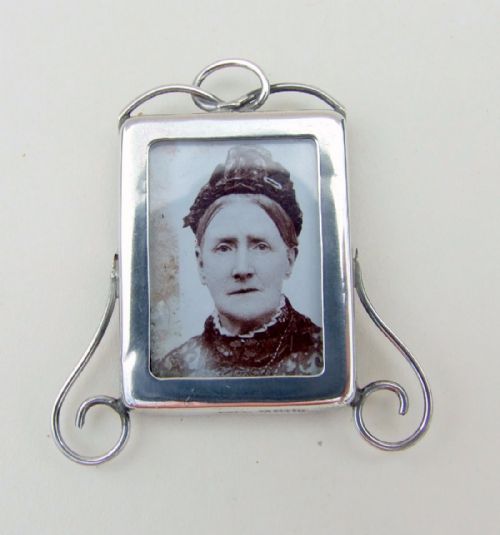 A Charming Miniature Silver Photo Frame.