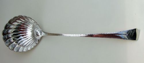 fig 1. A superb George III shell bowl silver soup ladle.