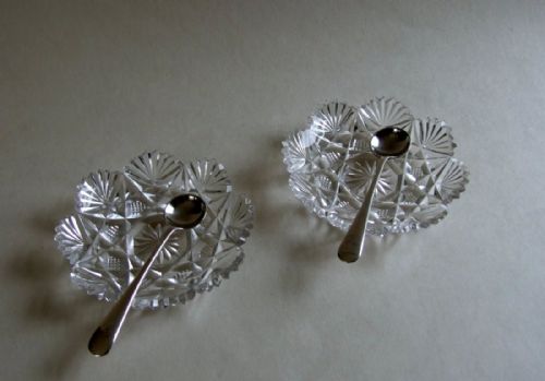 fig 1. A delightful pair of Edwardian cut glass condiment dishes and silver spoons.