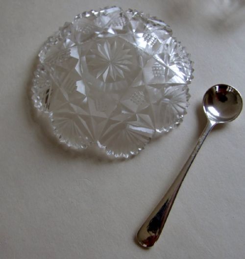 fig 2. A delightful pair of Edwardian cut glass condiment dishes and silver spoons.