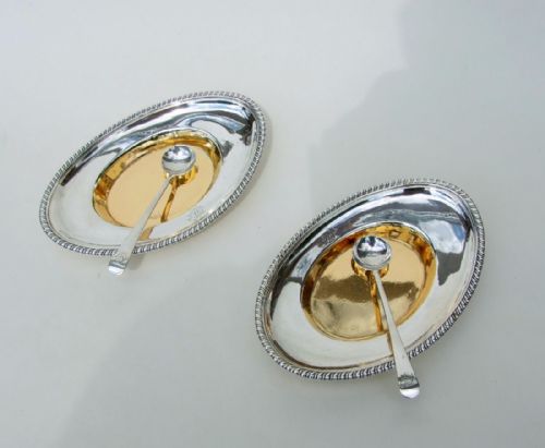 A Rare Pair of Georgian Silver Gilt Condiment Trays with Spoons.