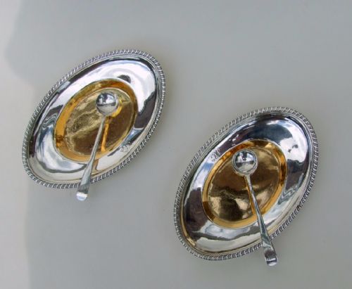 fig 1. A rare pair of Georgian silver gilt condiment trays with spoons.