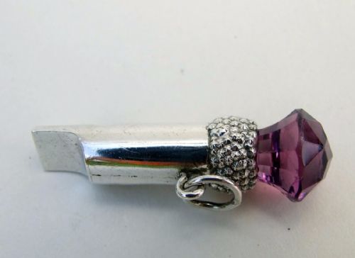 fig 1. A rare Edwardian silver whistle set with glass amethyst thistle.