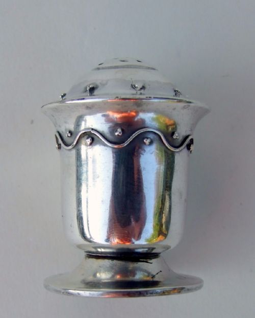 A Rare Liberty & Co. Arts & Crafts Silver Pepper Pot.