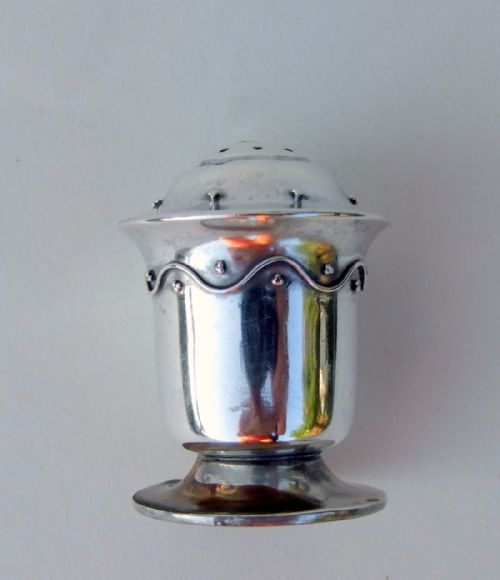 fig 1. A rare Liberty & Co. Arts & Crafts silver pepper pot.