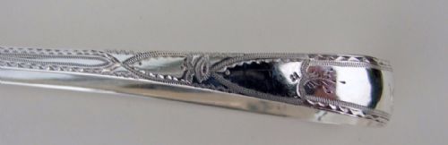 fig 1. A gorgeous pair of 18th Century Bright cut silver tongs.