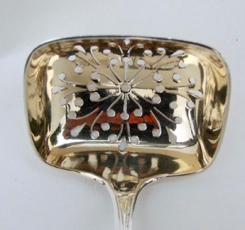 fig 1. A stylish George V silver gilt sifter spoon.