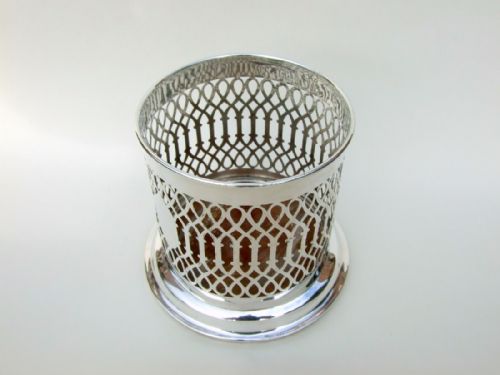 fig 1. A charming George V pierced silver wine bottle coaster.