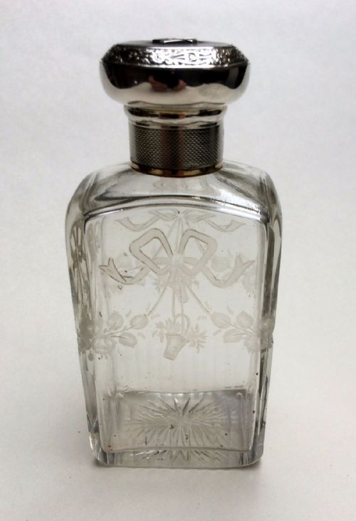A Delightful George V Silver Mounted Cologne Bottle.