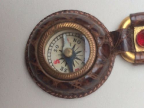 fig 1. A vintage traveler's compass and thermometer fob. 