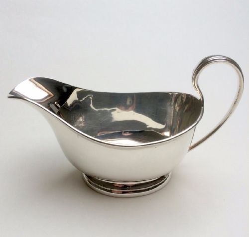 An Art Deco Handsome Silver Gravy Boat.
