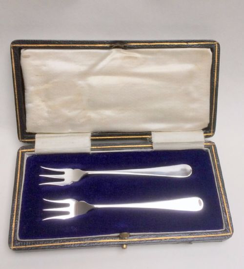 A Charming Boxed Pair of Silver Pickle Forks.