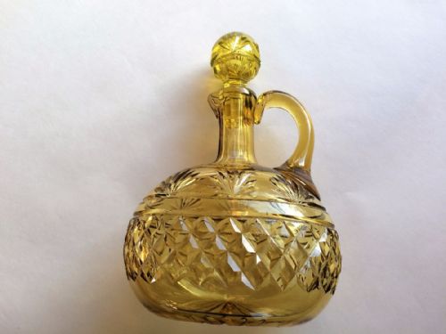 fig 1. A striking amber cut glass wine jug and stopper by Webb.