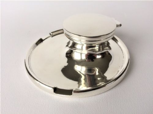 fig 1. A smart capstan silver inkwell from the Art Deco period.