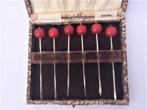 A Jazz Age Set of Six Silver Cocktail Sticks.